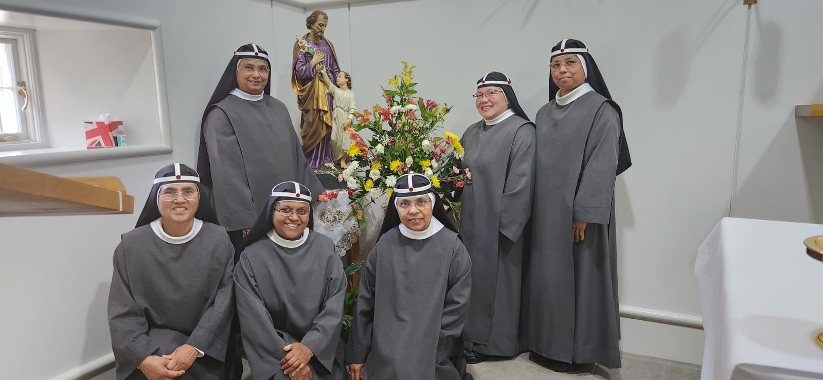 Sisters in chapel with St Joseph statue