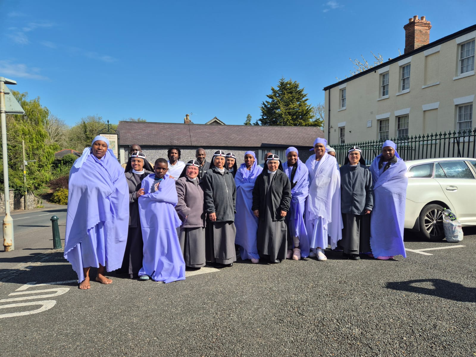 Pilgrims outside the guest house